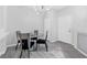 Dining area features a glass-top table and four modern chairs at 2251 Wigwam Pkwy # 218, Henderson, NV 89074