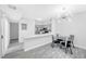 Modern kitchen with stainless steel appliances and breakfast bar flows into dining area at 2251 Wigwam Pkwy # 218, Henderson, NV 89074