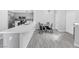Modern kitchen with island and breakfast bar with gray cabinets at 2251 Wigwam Pkwy # 218, Henderson, NV 89074