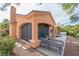 Backyard with screened patio, lounge chairs, and hot tub at 2520 Links Dr, Laughlin, NV 89029