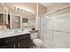 Clean bathroom with a single vanity, toilet and shower at 2520 Links Dr, Laughlin, NV 89029