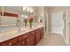 Double vanity bathroom with dark wood cabinets and tile flooring at 2520 Links Dr, Laughlin, NV 89029