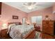 Charming bedroom with hardwood floors and floral bedding at 2520 Links Dr, Laughlin, NV 89029