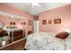 Bedroom with mirrored closet doors and floral bedding at 2520 Links Dr, Laughlin, NV 89029