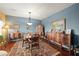 Elegant dining room with hardwood floors and antique furniture at 2520 Links Dr, Laughlin, NV 89029