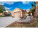 One-story house with two-car garage, landscaped yard, and walkway at 2520 Links Dr, Laughlin, NV 89029