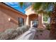 Front porch entryway with seating and landscaping at 2520 Links Dr, Laughlin, NV 89029