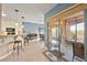 Kitchen with breakfast bar, view to patio, and white cabinets at 2520 Links Dr, Laughlin, NV 89029