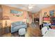 Bright office features a comfy couch, built-in shelving, and wood floors at 2520 Links Dr, Laughlin, NV 89029