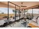 Relaxing screened patio with wicker furniture overlooking a golf course at 2520 Links Dr, Laughlin, NV 89029