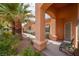 Covered patio area with seating, located in the side yard at 2520 Links Dr, Laughlin, NV 89029