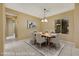 Virtually staged dining room with a six-chair table and contemporary rug at 2964 Sumter Valley Cir, Henderson, NV 89052