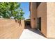Cozy backyard featuring a cemented patio with a tall wall around it at 3396 Villa Fiori Ave, Las Vegas, NV 89141