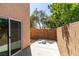 Backyard view of cemented patio and brick walls for privacy at 3396 Villa Fiori Ave, Las Vegas, NV 89141