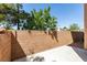 Backyard space featuring brick wall that provides privacy for entertaining and relaxing at 3396 Villa Fiori Ave, Las Vegas, NV 89141