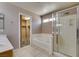 Bright bathroom featuring a shower, bathtub, and sink, with a glimpse into the walk-in closet at 3396 Villa Fiori Ave, Las Vegas, NV 89141