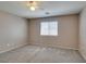 Comfortable bedroom featuring neutral paint, carpet, and a window providing natural light, ready for your personal touch at 3396 Villa Fiori Ave, Las Vegas, NV 89141