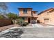 Charming two-story home with stucco exterior, red tile roof, and an attached one car garage at 3396 Villa Fiori Ave, Las Vegas, NV 89141