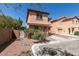 Charming two-story home with stucco exterior, red tile roof, and an attached one car garage at 3396 Villa Fiori Ave, Las Vegas, NV 89141