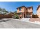 Charming two-story home with stucco exterior, red tile roof, and an attached one car garage at 3396 Villa Fiori Ave, Las Vegas, NV 89141