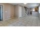 Open-concept living space with tile, leading to staircase, kitchen, and additional rooms at 3396 Villa Fiori Ave, Las Vegas, NV 89141