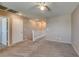 Carpeted living area with a railing, a ceiling fan, and recessed lighting at 3396 Villa Fiori Ave, Las Vegas, NV 89141