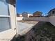 Small backyard with gravel and a concrete patio at 4202 Mango Tree Ct, Las Vegas, NV 89115