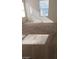 Spacious bedroom with neutral carpeting and large window at 4202 Mango Tree Ct, Las Vegas, NV 89115