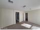 Spacious bedroom with carpet and access to bathroom and another room at 4202 Mango Tree Ct, Las Vegas, NV 89115