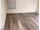 Living room with gray vinyl plank flooring at 4202 Mango Tree Ct, Las Vegas, NV 89115