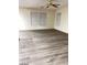 Bright living room featuring vinyl plank flooring and ceiling fan at 4202 Mango Tree Ct, Las Vegas, NV 89115