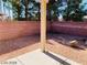 Backyard with gravel, covered patio, and block wall at 43 Pangloss St, Henderson, NV 89002