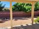 Backyard with covered patio, gravel, and block wall at 43 Pangloss St, Henderson, NV 89002