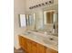 Primary bathroom with double vanity and soaking tub at 43 Pangloss St, Henderson, NV 89002