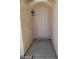 Front entry of the house with light fixture and door at 43 Pangloss St, Henderson, NV 89002