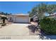 One-story house with a two-car garage and desert landscaping at 43 Pangloss St, Henderson, NV 89002