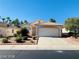 Single-story house with a two-car garage and well-maintained yard at 43 Pangloss St, Henderson, NV 89002