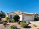 One-story house with a two-car garage and landscaped front yard at 43 Pangloss St, Henderson, NV 89002