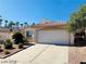 Front view of a single-story house with a two-car garage at 43 Pangloss St, Henderson, NV 89002
