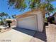 Detached garage with driveway and desert landscaping at 43 Pangloss St, Henderson, NV 89002