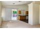 Open concept living room with kitchen and access to backyard at 43 Pangloss St, Henderson, NV 89002
