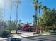 Community playground with playset and palm trees at 43 Pangloss St, Henderson, NV 89002