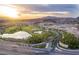 Aerial view of a luxury community with a bridge and golf course at 52 Reverie Heights Ave, Henderson, NV 89011