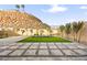 Landscaped backyard with artificial turf and stone at 52 Reverie Heights Ave, Henderson, NV 89011