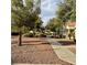 Landscaped pathway with trees and desert plants at 5400 Paul Kurtz Way # 102, Las Vegas, NV 89108