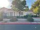 Single-story house with red tile roof, landscaping, and a walkway at 5400 Paul Kurtz Way # 102, Las Vegas, NV 89108