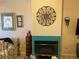 Fireplace with teal tile surround and decorative wall art at 5400 Paul Kurtz Way # 102, Las Vegas, NV 89108