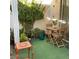 Private patio with seating area, lush greenery, and decorative accents at 5400 Paul Kurtz Way # 102, Las Vegas, NV 89108