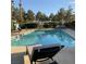 Community pool with lounge chairs at 5400 Paul Kurtz Way # 102, Las Vegas, NV 89108