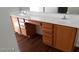 Bathroom with double vanity and wood cabinets at 5987 Stone Hollow Ave, Las Vegas, NV 89156